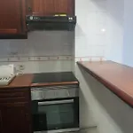 Em *